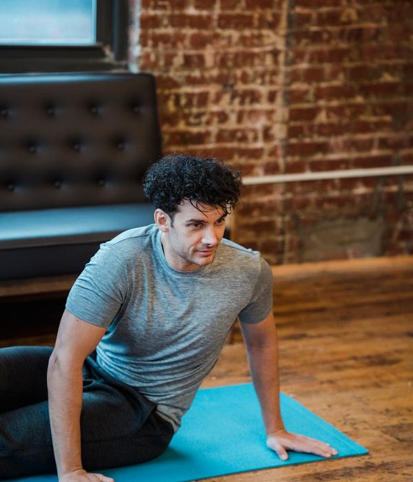Man practicing strength movements for endurance and energy